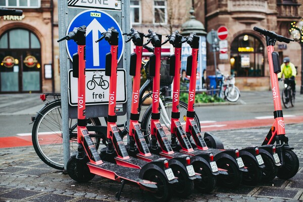 ▲ E-scooters parked in a parking area